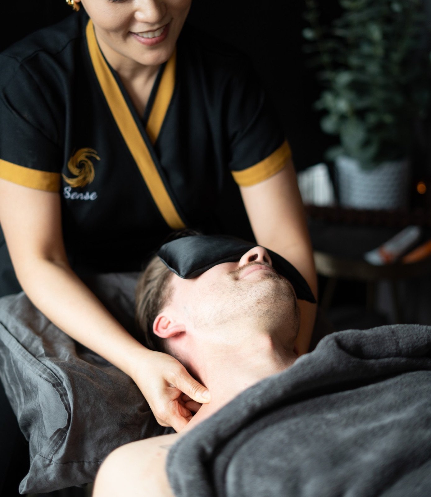 Sense therapist easing neck tension during an Office Syndrome Relief treatment